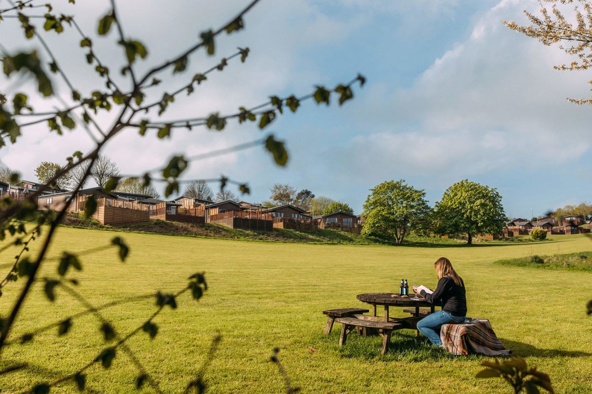 Devon Hills Overview Lady Reading On Bench