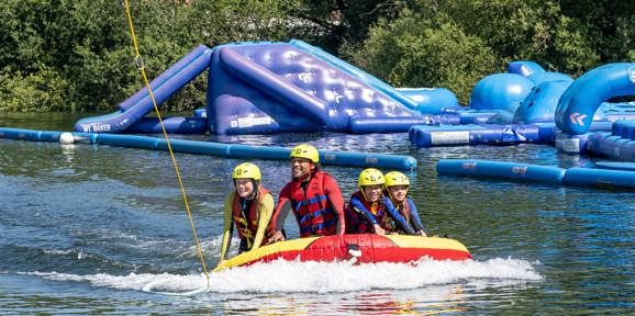 Delamere Family In Boat At Waterpark
