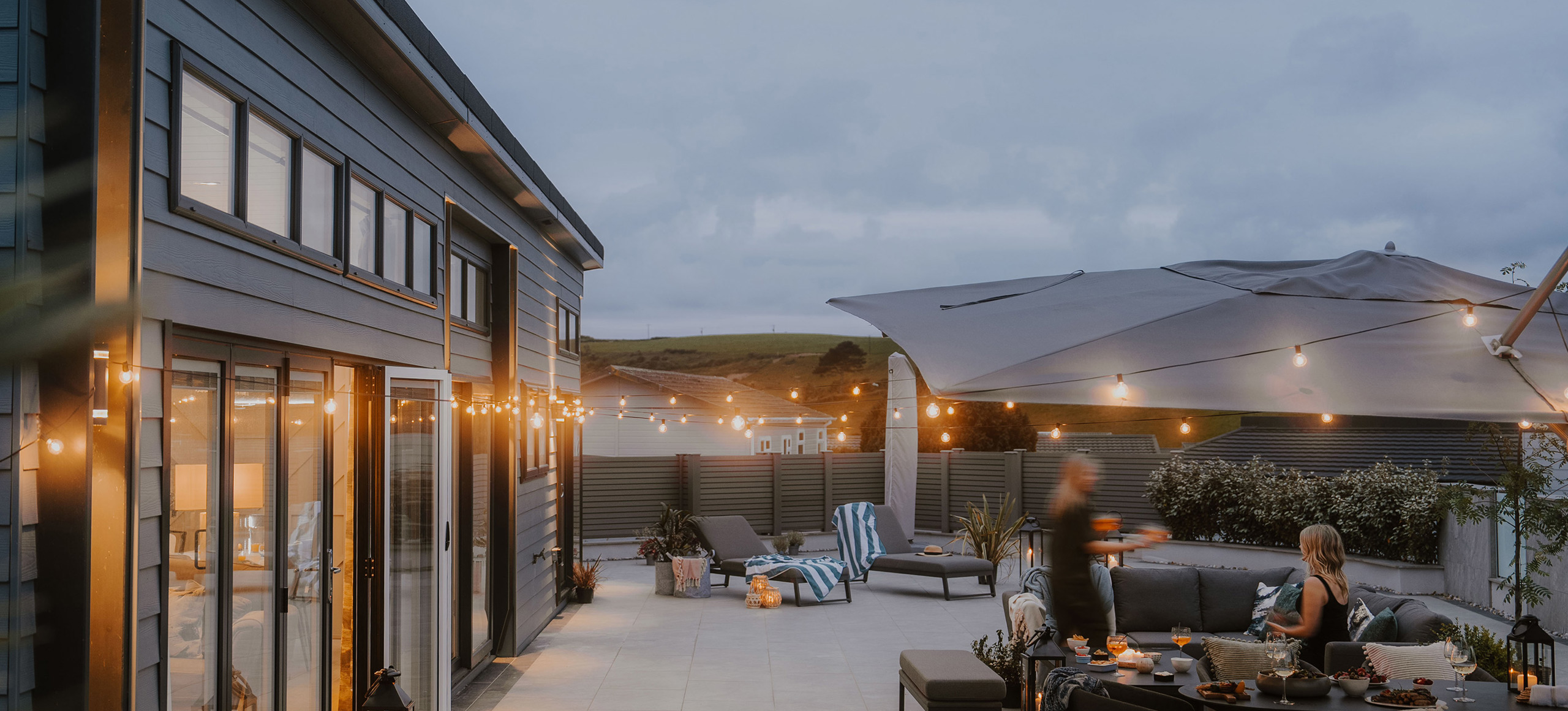 The Warren Evening Decking With Friends Having A Party