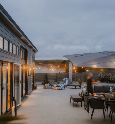 The Warren Evening Decking With Friends Having A Party