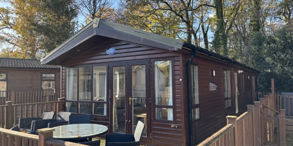 Regal Autograph, front exterior with patio furniture at Finlake