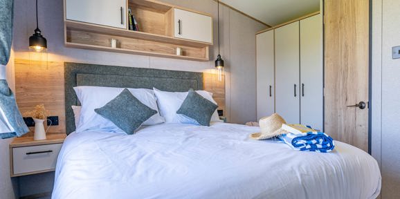 ABI St David, double bed in master bedroom at Praa Sands