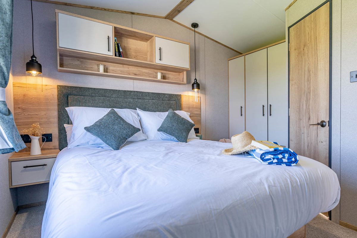 ABI St David, double bed in master bedroom at Praa Sands