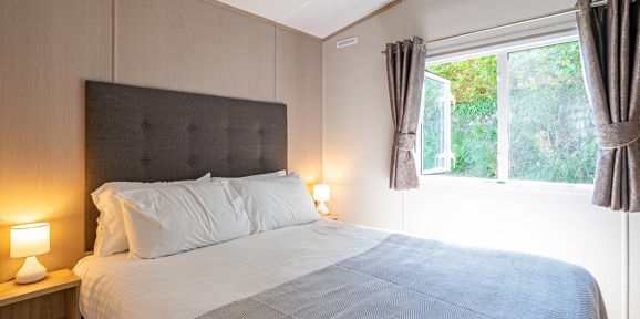 Carnaby Ashdale, master bedroom with open window at Praa Sands