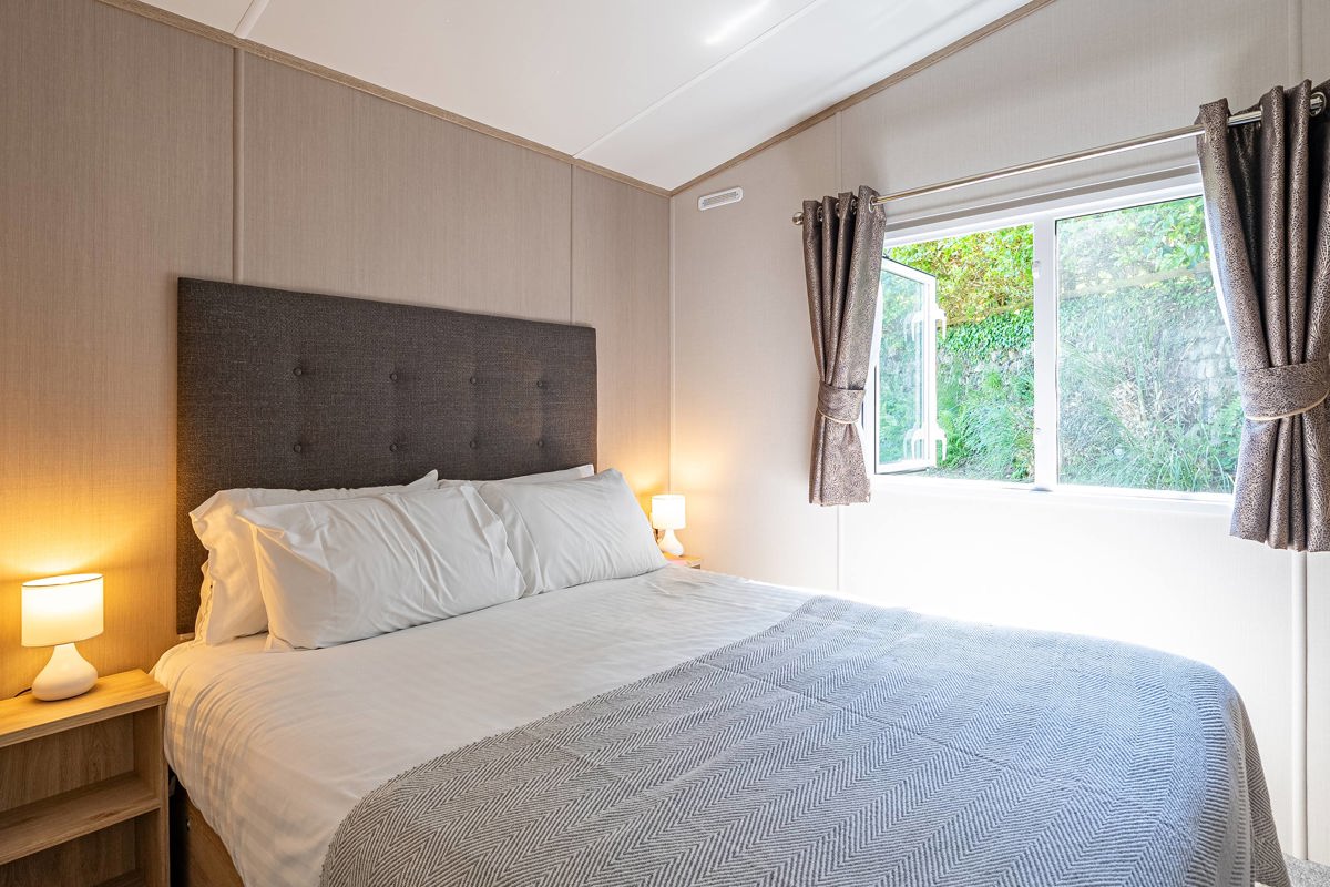 Carnaby Ashdale, master bedroom with open window at Praa Sands