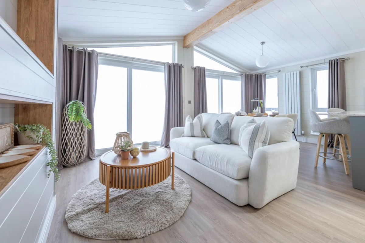 Wessex Contemporary living room with patio doors at The Warren