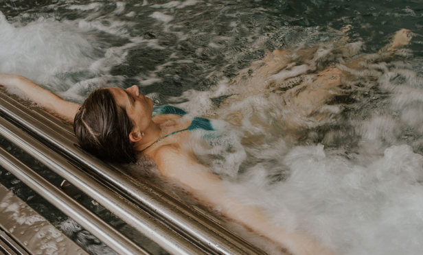 The Warren Lady Floating In Spa Pool Bubbles
