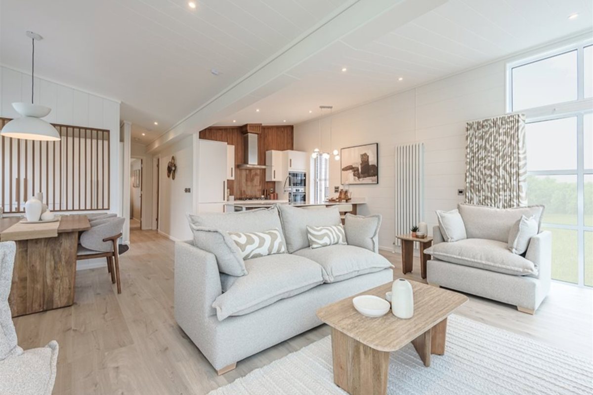 Prestige Aura, living area with sofas at The Warren