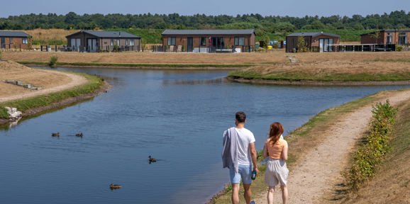 Delamere Couple Walking By The Lagoon