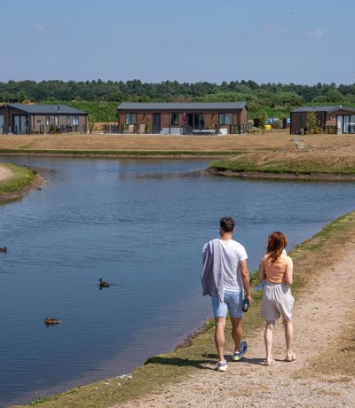 Delamere Couple Walking By The Lagoon