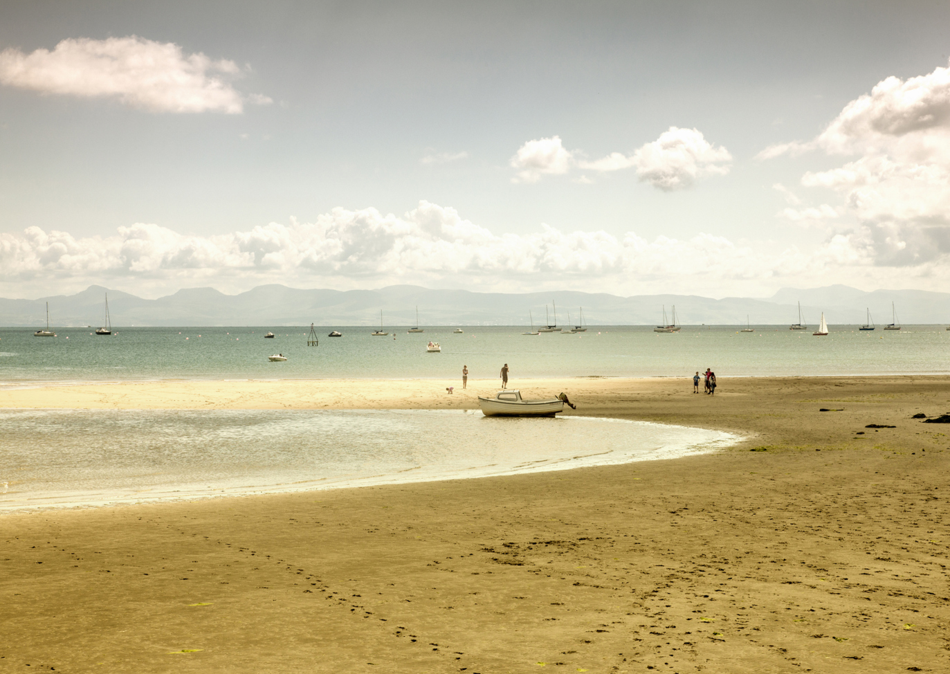 Beach with boats in Wales