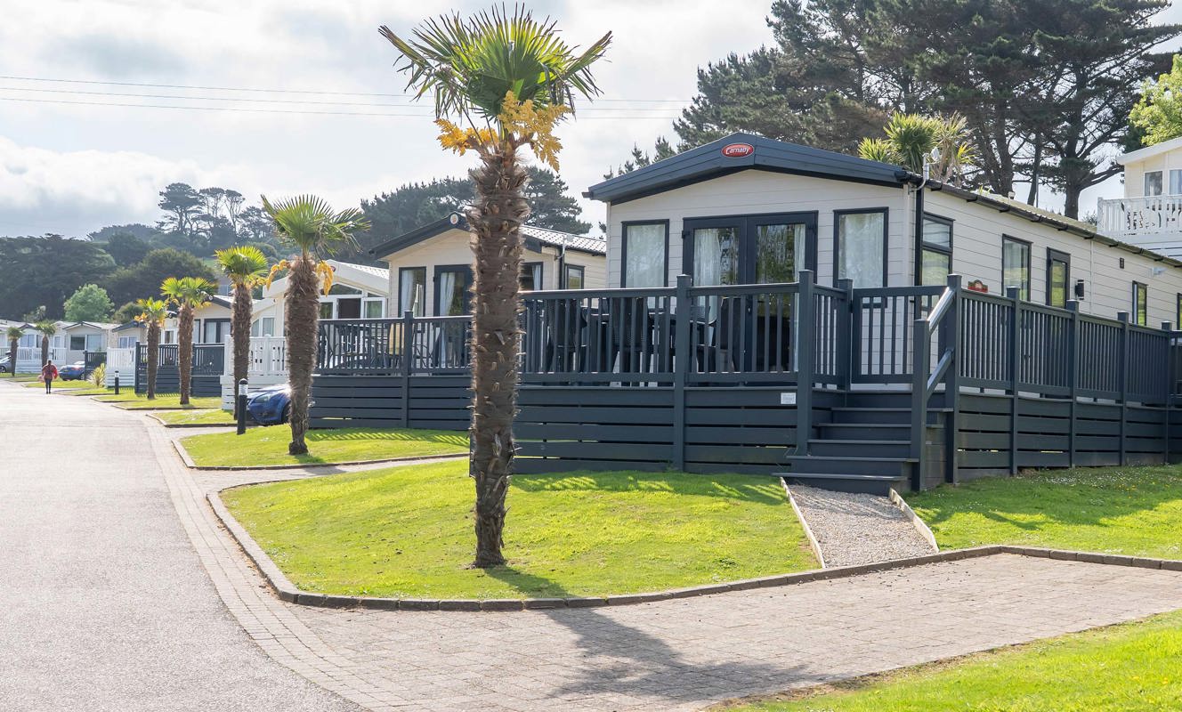 Praa Sands Row Of Lodges With Palm Trees