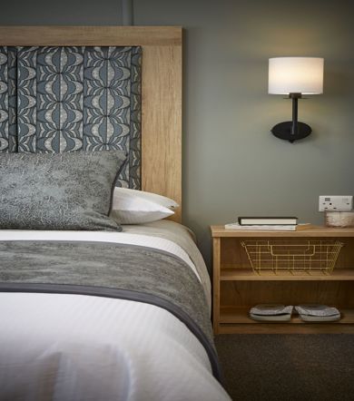 Carnaby Silverdale, master bedroom with lamp at Brokerswood