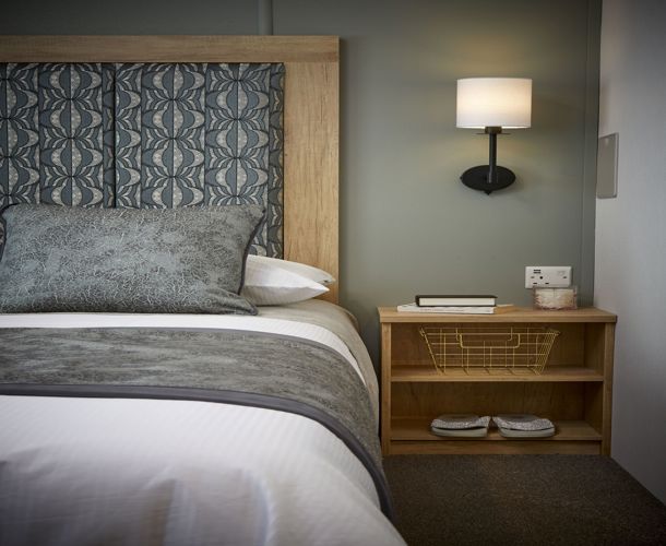 Carnaby Silverdale, master bedroom with lamp at Brokerswood