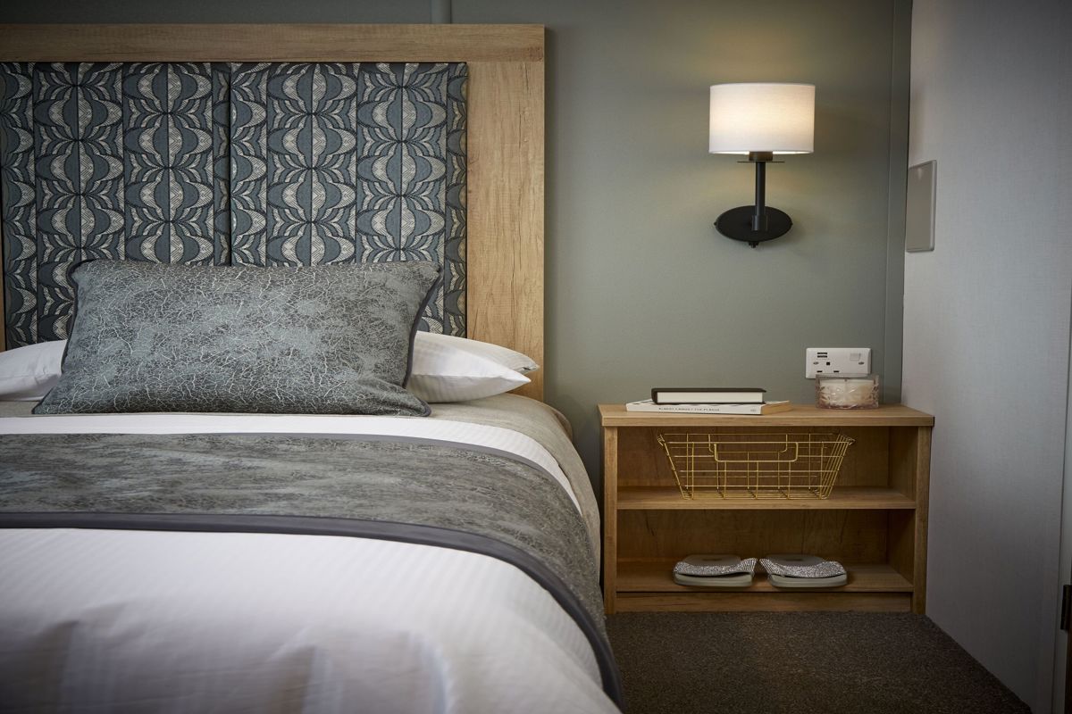Carnaby Silverdale, master bedroom with lamp at Brokerswood