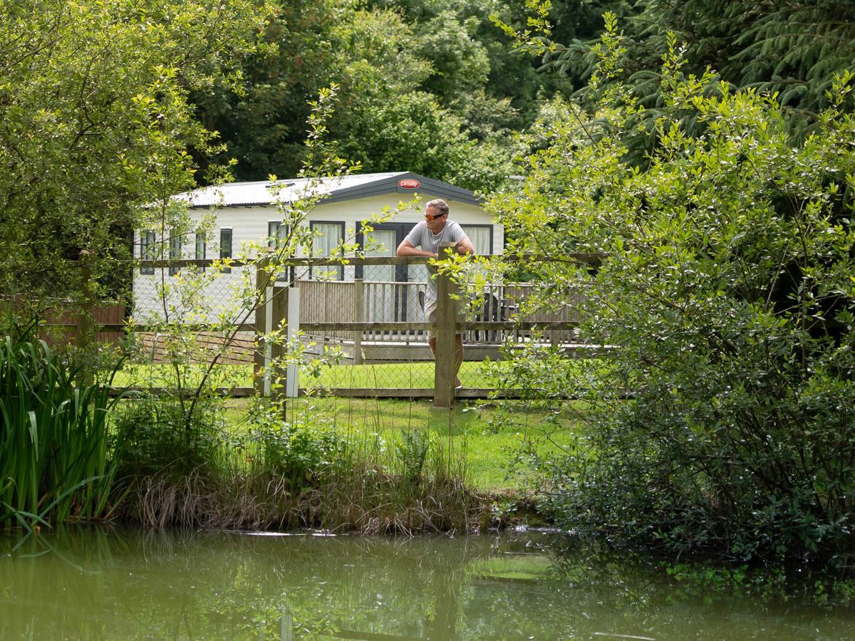 Man Overlooking Pond at Dartmoor View