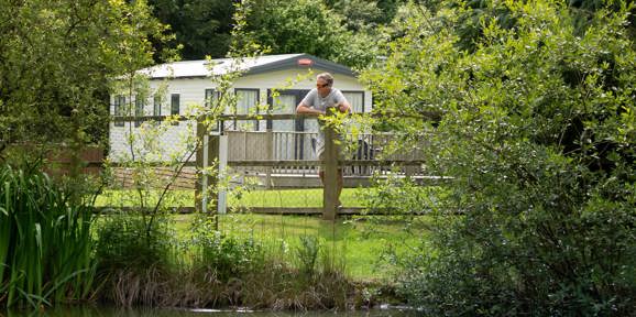Man Overlooking Pond at Dartmoor View