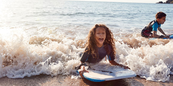 Kids Bodyboarding near Devon Seaside