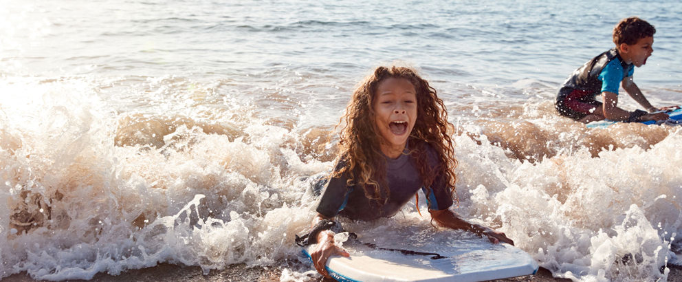 Kids Bodyboarding near Devon Seaside