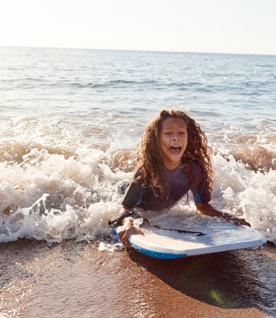 Kids Bodyboarding near Devon Seaside