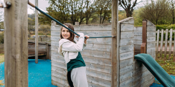 Devon Hills Overview Child On Playground