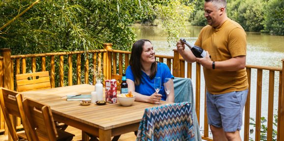 Brokerswood Couple Having Bubbles On The Decking