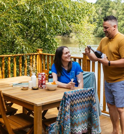 Brokerswood Couple Having Bubbles On The Decking