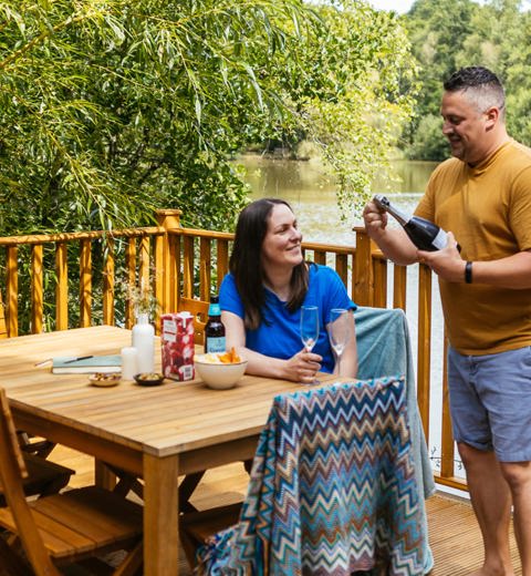 Brokerswood Couple Having Bubbles On The Decking