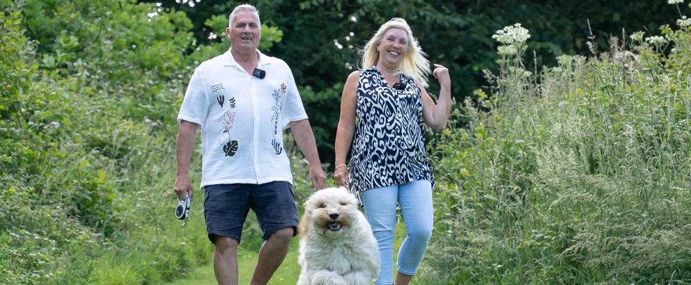 Couple walking their dog in Devon Hills countryside