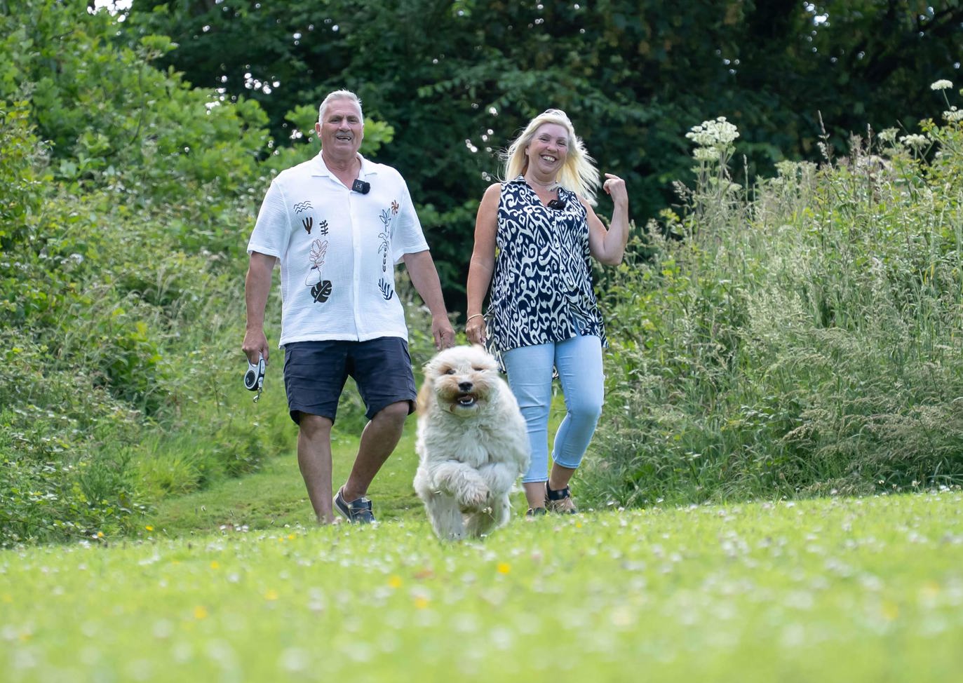 Couple walking their dog in Devon Hills countryside