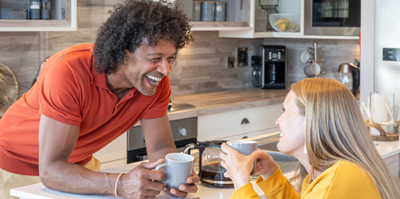 Delamere Couple Talking In Kitchen