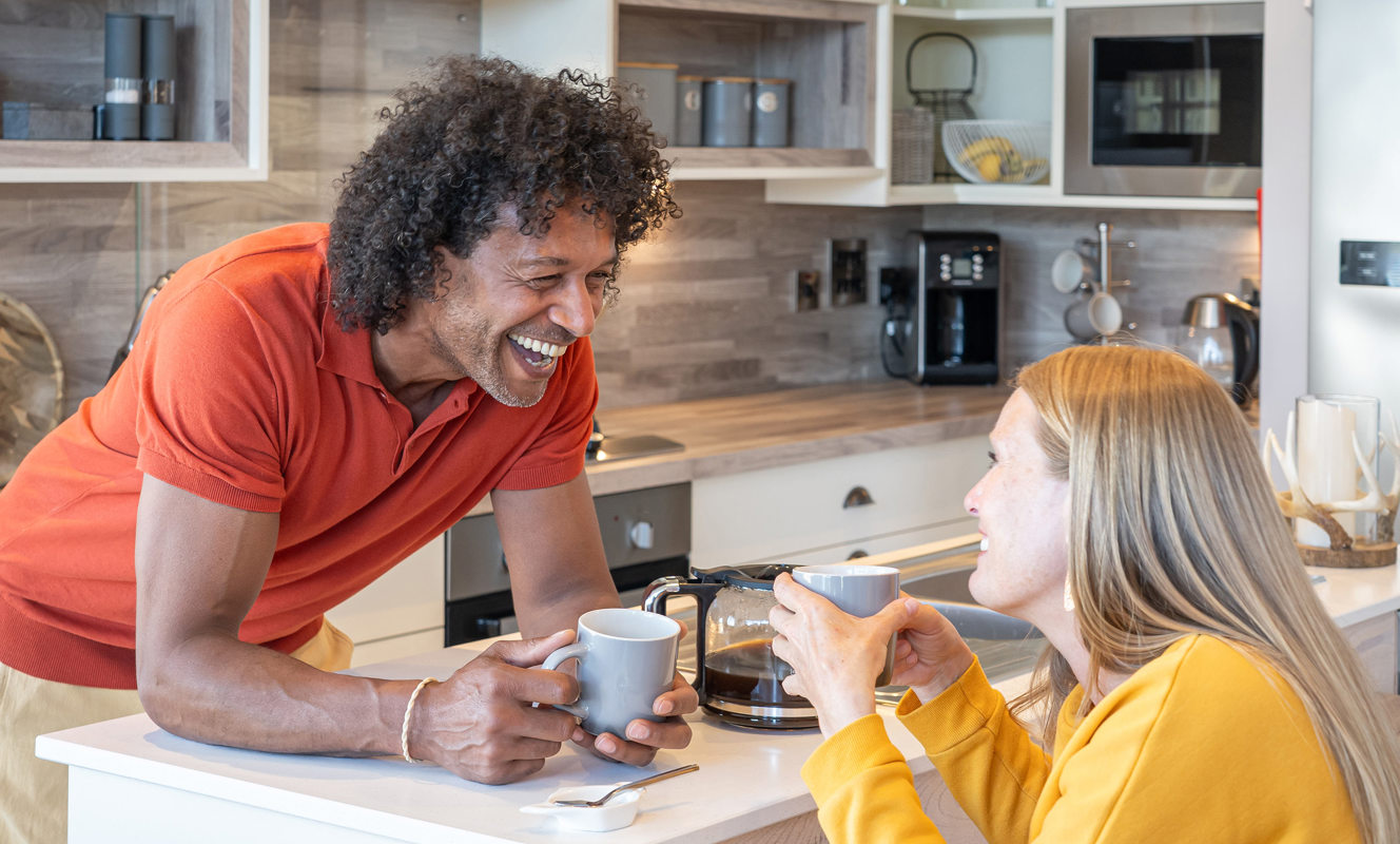 Delamere Couple Talking In Kitchen