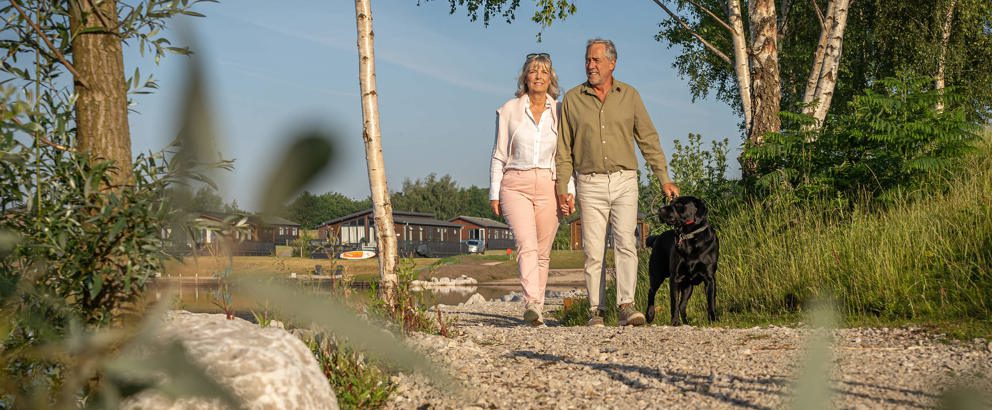 Delamere Couple Taking A Stroll With Dog