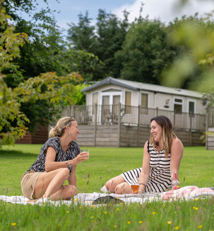 2 Women chatting outside Dartmoor View lodges