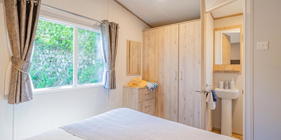Carnaby Ashdale, master bedroom with window at Praa Sands