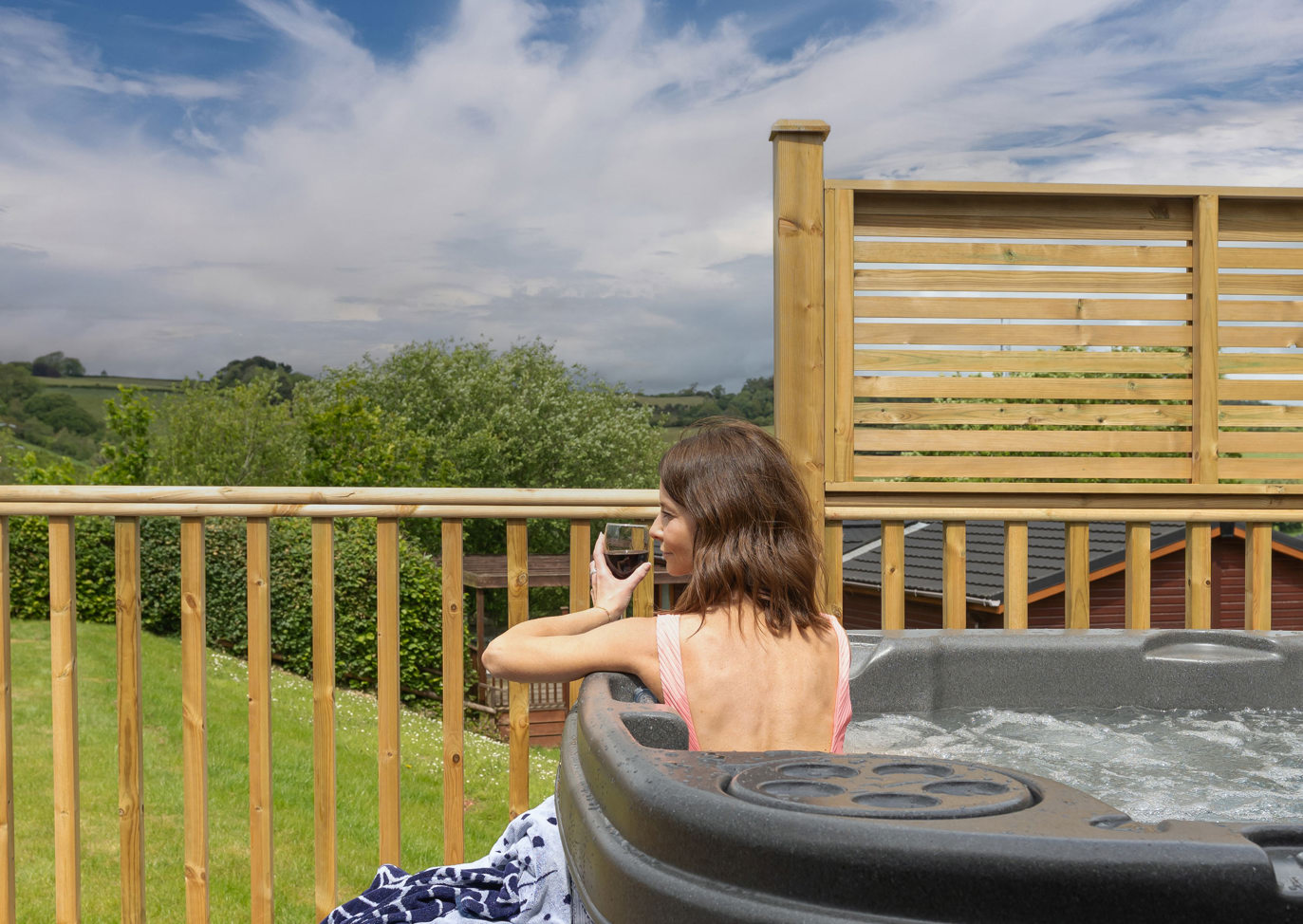 Devon Hills Lady Relaxing With Wine In The Hot Tub
