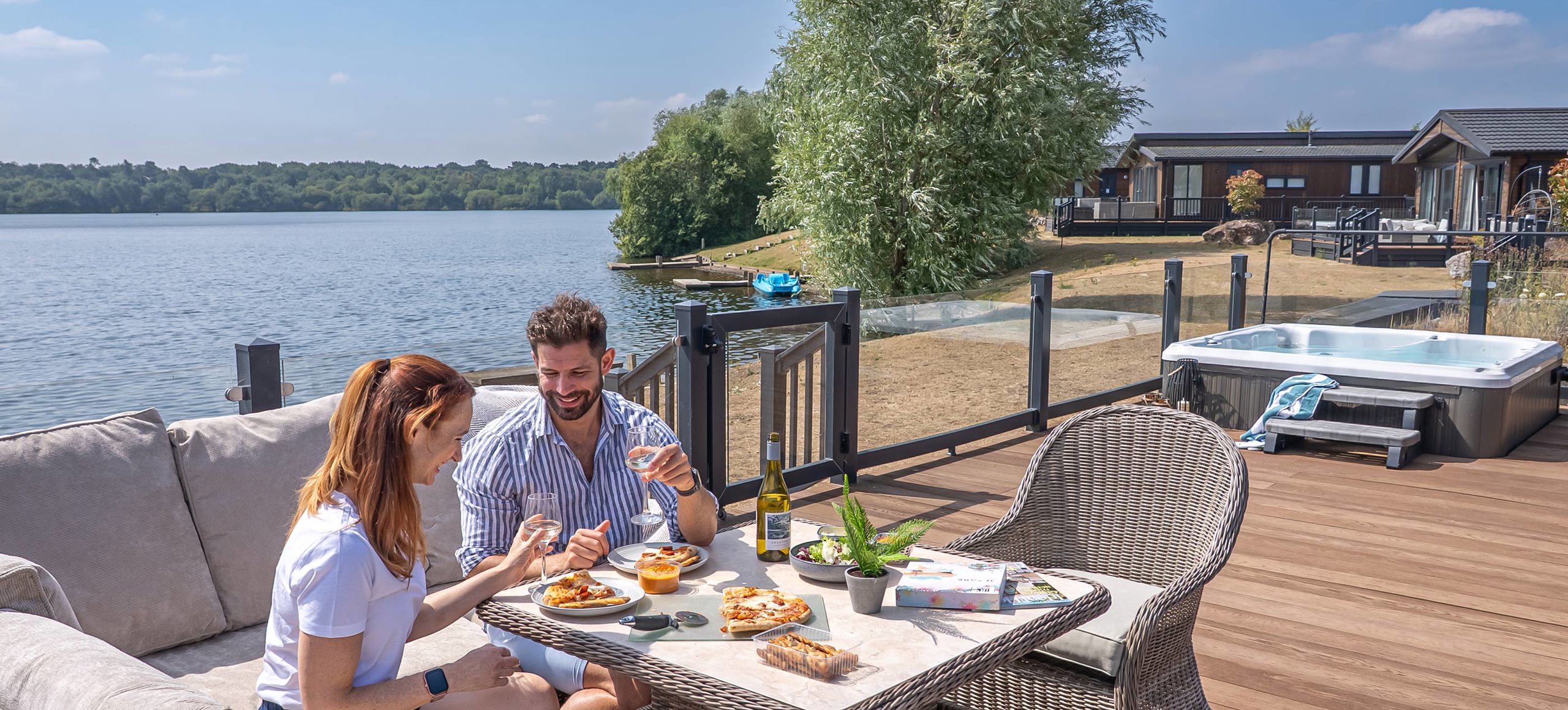 Delamere Couple Eating Pizza Outside Holiday Home