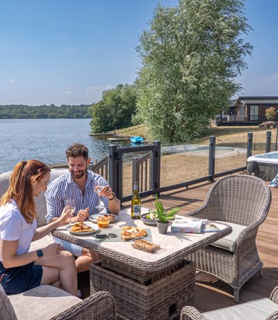Delamere Couple Eating Pizza Outside Holiday Home