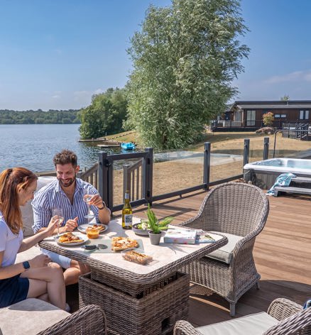Delamere Couple Eating Pizza Outside Holiday Home