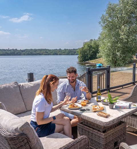 Delamere Couple Eating Pizza Outside Holiday Home