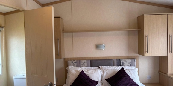 Carnaby Melrose, master bedroom and ensuite at Dartmoor View 