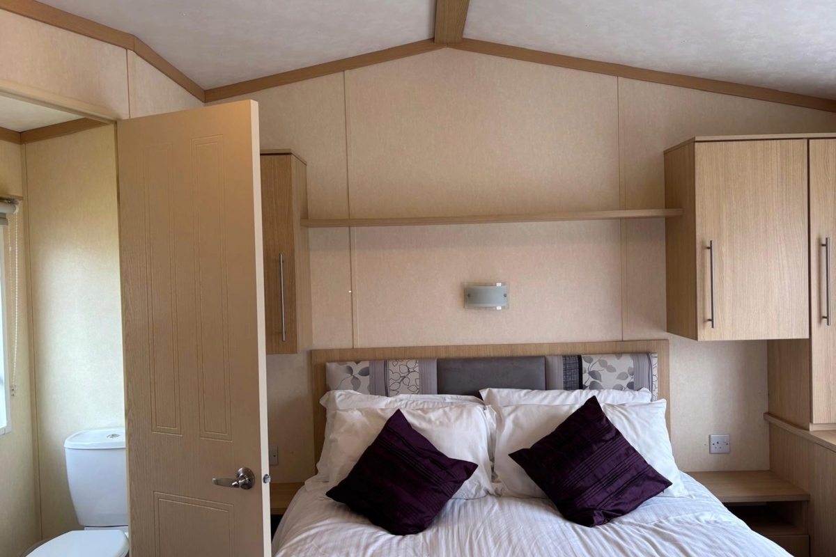 Carnaby Melrose, master bedroom and ensuite at Dartmoor View 
