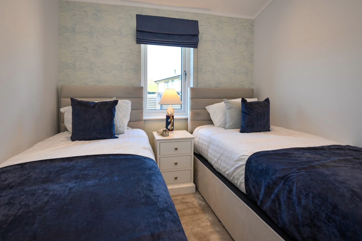 Oakgrove Osprey, blue twin bedroom at The Warren