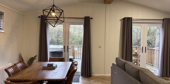 Prestige Dovecote, dining room and patio doors at Brokerswood