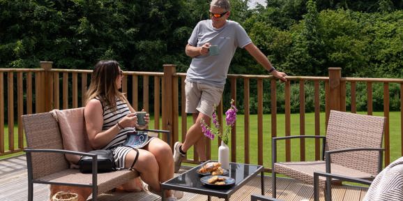 Dartmoor View Couple Talking On Decking