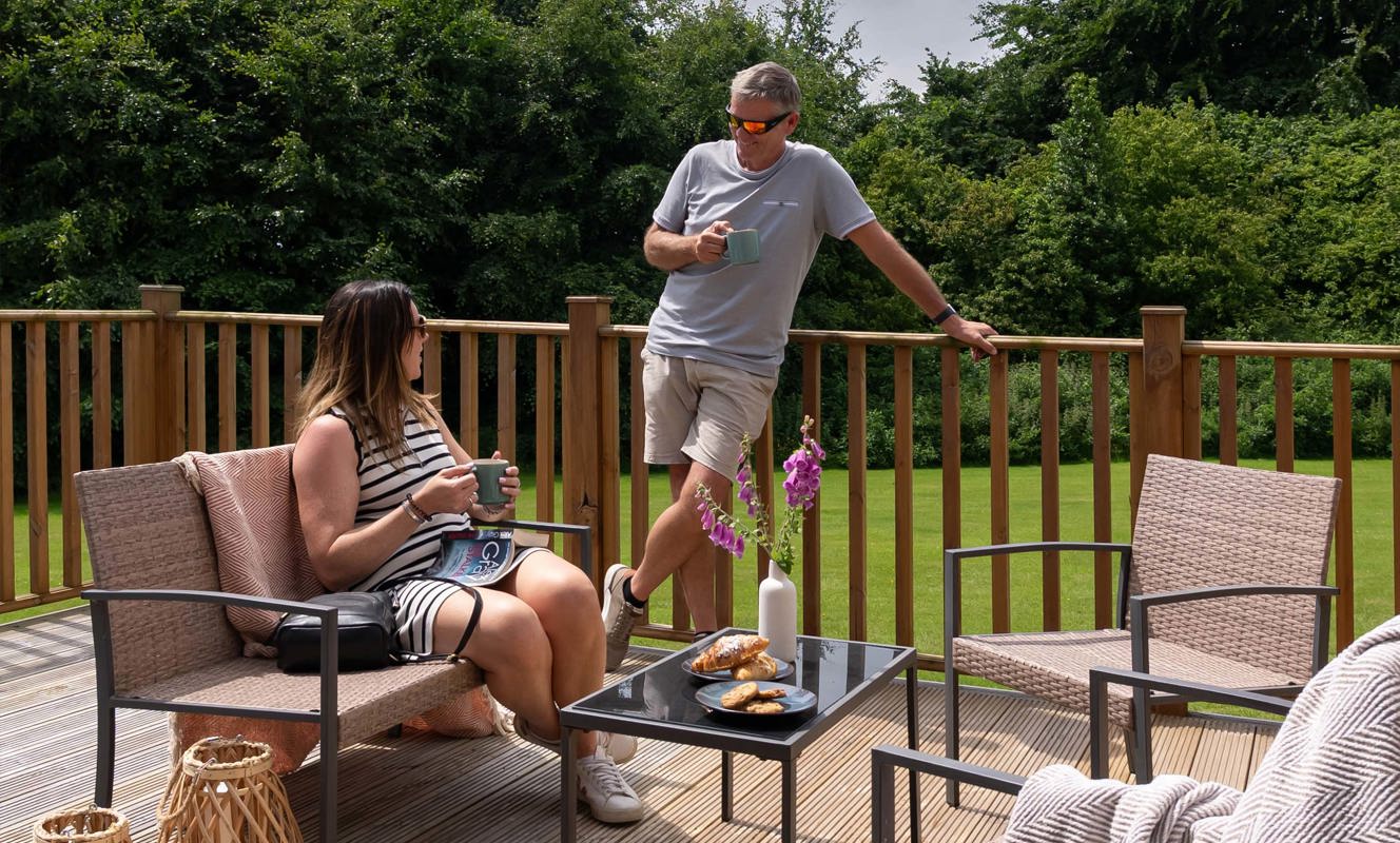 Dartmoor View Couple Talking On Decking