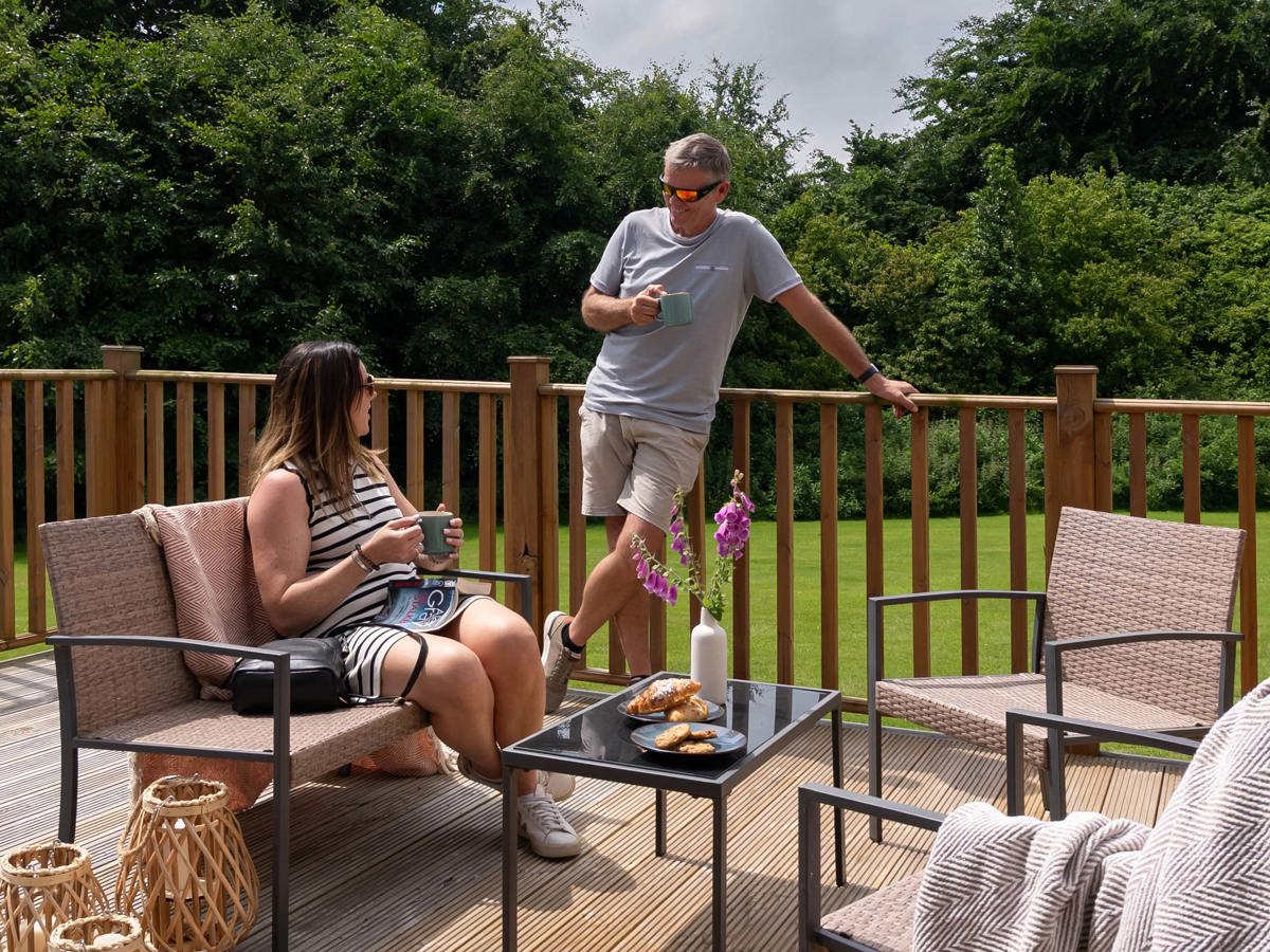 Dartmoor View Couple Talking On Decking