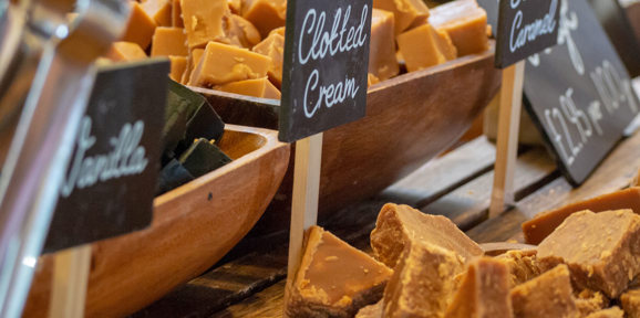 Display of homemade Cornish fudge in flavours like clotted cream and vanilla, near Praa Sands Holiday Park.