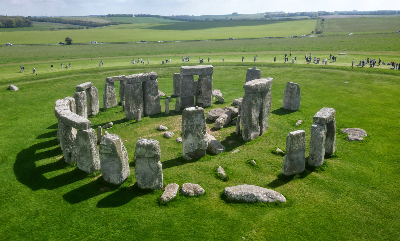 Famous prehistoric Stonehenge stone circle in Wiltshire, surrounded by green fields, Near Brokerswood Holiday Park
