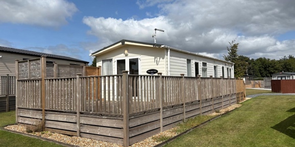 Carnaby Melrose, exterior with decking at Dartmoor View